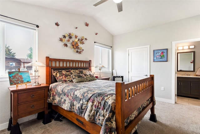 435 6th Ave NW, Ronan, MT 59864 - bedroom with carpet flooring, vaulted ceiling, baseboards, connected bathroom, and ceiling fan