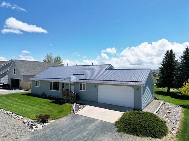 506 Centennial Dr, Sheridan, MT 59749 - ranch-style house with an attached garage, driveway, a front lawn, and metal roof