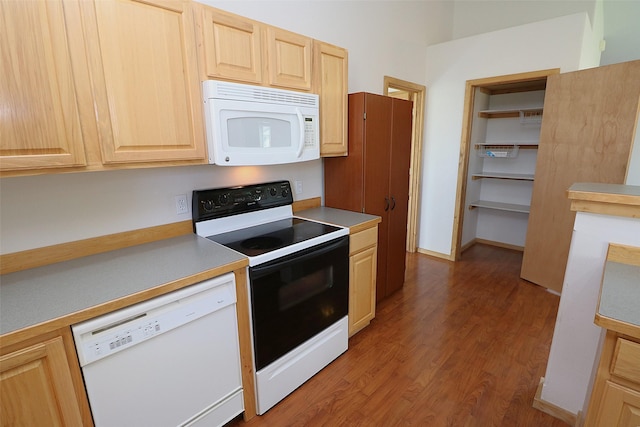 506 Centennial Dr, Sheridan, MT 59749 - kitchen featuring white appliances, light brown cabinets, wood finished floors, and light countertops