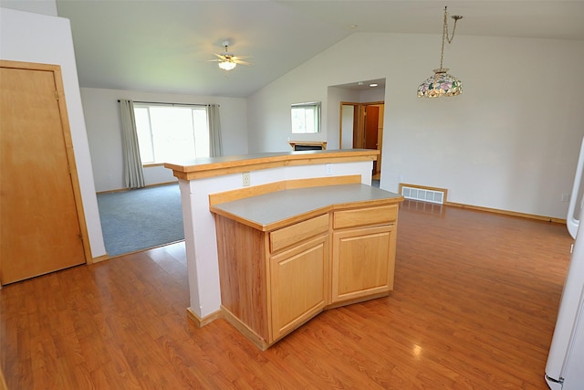 506 Centennial Dr, Sheridan, MT 59749 - kitchen featuring a ceiling fan, open floor plan, lofted ceiling, light wood-style floors, and baseboards