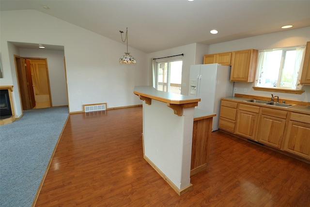 506 Centennial Dr, Sheridan, MT 59749 - kitchen featuring a sink, white fridge with ice dispenser, lofted ceiling, healthy amount of natural light, and wood finished floors