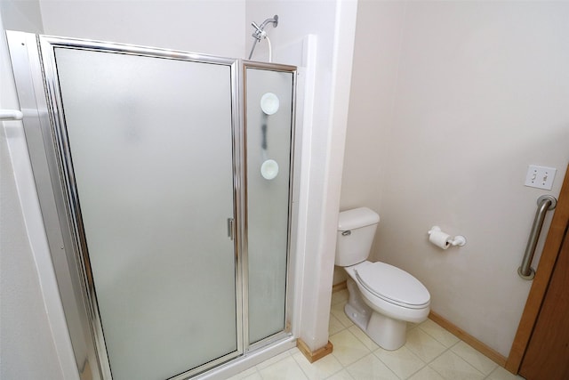 506 Centennial Dr, Sheridan, MT 59749 - full bathroom with a shower stall, toilet, baseboards, and tile patterned flooring