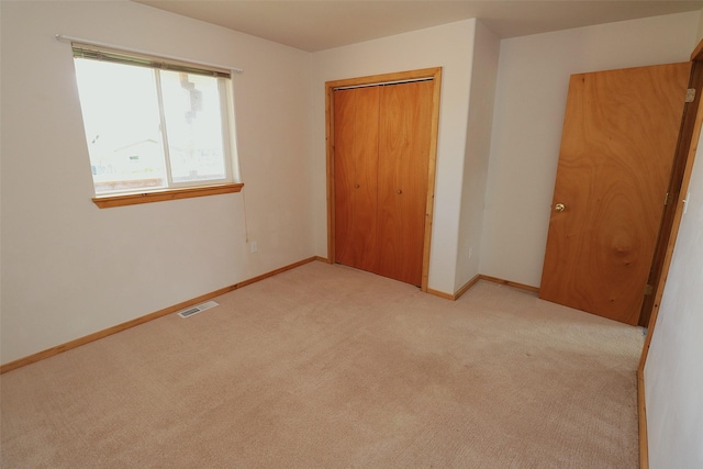 506 Centennial Dr, Sheridan, MT 59749 - unfurnished bedroom with light carpet, a closet, and baseboards