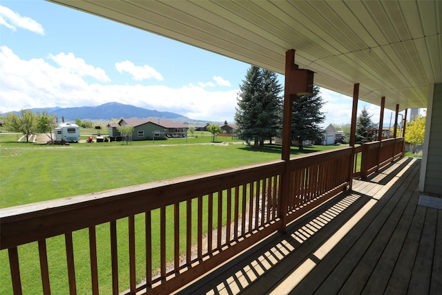 506 Centennial Dr, Sheridan, MT 59749 - wooden deck featuring a mountain view, a lawn, and a residential view