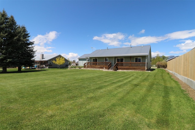 506 Centennial Dr, Sheridan, MT 59749 - rear view of property with a wooden deck and metal roof