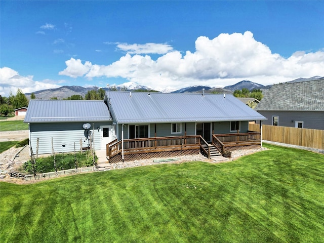 506 Centennial Dr, Sheridan, MT 59749 - back of property featuring metal roof and a deck with mountain view