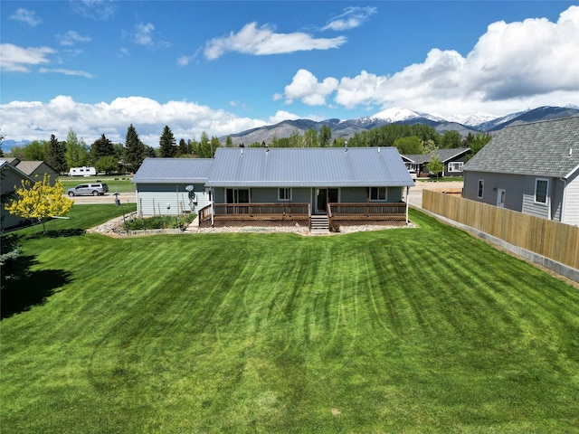 506 Centennial Dr, Sheridan, MT 59749 - back of house with a mountain view, metal roof, and covered porch