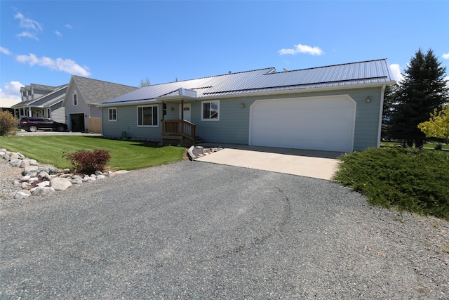506 Centennial Dr, Sheridan, MT 59749 - single story home with an attached garage, asphalt driveway, a front yard, and metal roof