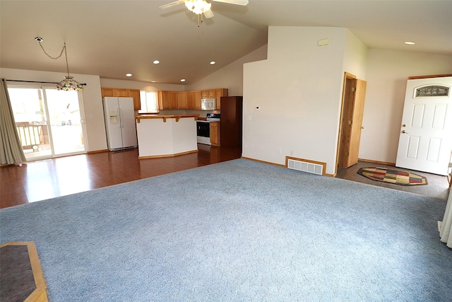 506 Centennial Dr, Sheridan, MT 59749 - living area featuring ceiling fan, vaulted ceiling, recessed lighting, dark colored carpet, and baseboards