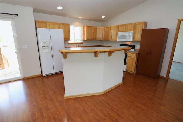 506 Centennial Dr, Sheridan, MT 59749 - kitchen featuring white appliances, a kitchen bar, wood finished floors, light countertops, and vaulted ceiling