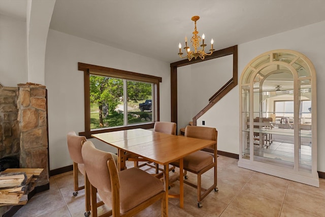 209 Caps Rd, Kalispell, MT 59901 - dining area with light tile patterned floors and a chandelier