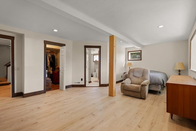 209 Caps Rd, Kalispell, MT 59901 - bedroom featuring light wood-style flooring, recessed lighting, and connected bathroom