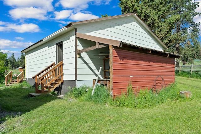 209 Caps Rd, Kalispell, MT 59901 - rear view of property with entry steps
