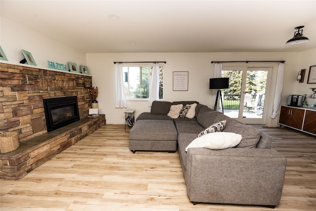 3495 Juniper Dr, Helena, MT 59602 - living room with wood finished floors, a fireplace, and baseboards