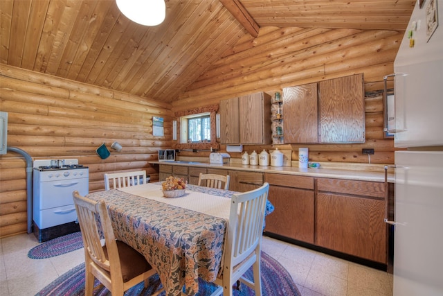 425 S O St, Sula, MT 59871 - dining room with wood ceiling with exposed beams, high vaulted ceiling, and log walls