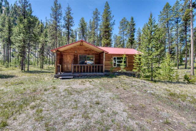 425 S O St, Sula, MT 59871 - view of front of property with log siding and metal roof