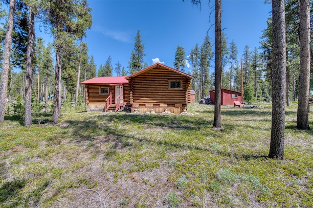425 S O St, Sula, MT 59871 - view of front of home with log exterior and entry steps