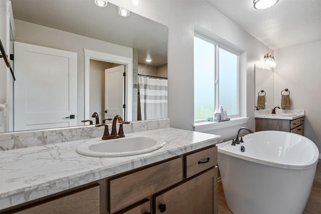 15276 Tyson Way, Frenchtown, MT 59834 - full bathroom with plenty of natural light, vanity, a freestanding tub, and curtained shower