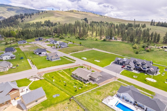 15276 Tyson Way, Frenchtown, MT 59834 - aerial perspective of suburban area featuring a pool and mountains