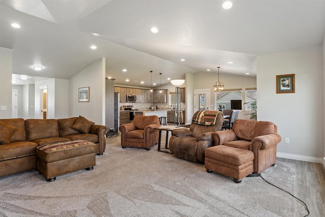 15276 Tyson Way, Frenchtown, MT 59834 - living area featuring vaulted ceiling, recessed lighting, and baseboards
