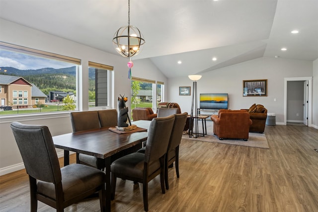 15276 Tyson Way, Frenchtown, MT 59834 - dining room featuring lofted ceiling, a mountain view, recessed lighting, light wood finished floors, and a chandelier
