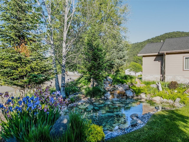 700 Airfield Rd, Libby, MT 59923 - view of yard featuring a small pond