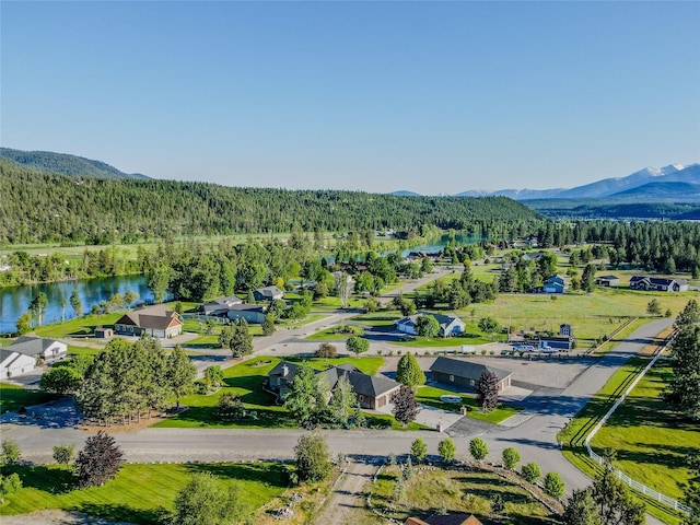700 Airfield Rd, Libby, MT 59923 - drone / aerial view of a heavily wooded area and a water and mountain view