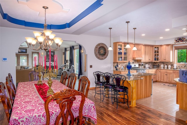 700 Airfield Rd, Libby, MT 59923 - dining area with arched walkways, a chandelier, light wood-style floors, and recessed lighting