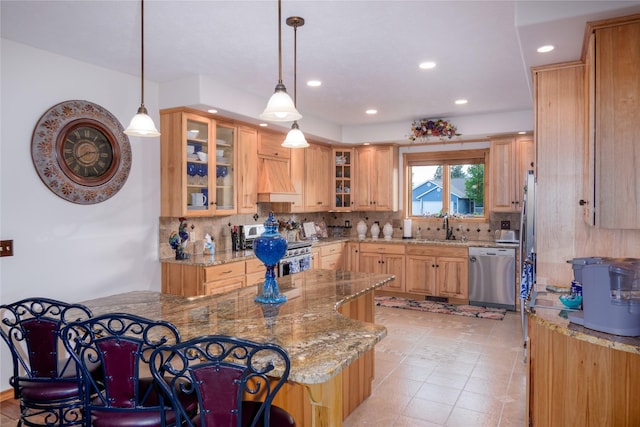 700 Airfield Rd, Libby, MT 59923 - kitchen with appliances with stainless steel finishes, backsplash, light stone counters, a sink, and recessed lighting