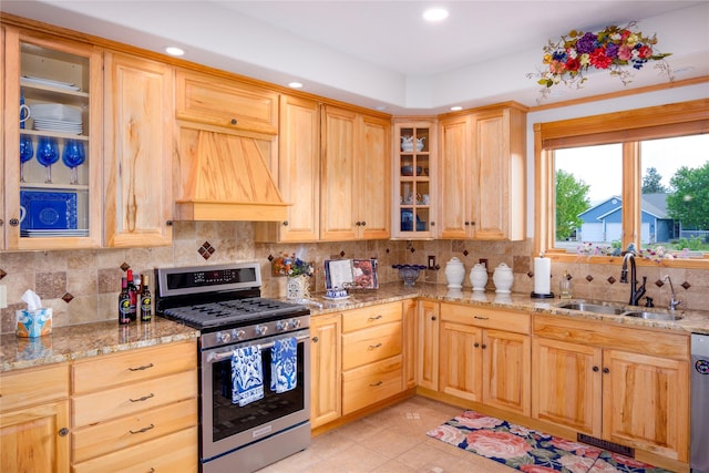 700 Airfield Rd, Libby, MT 59923 - kitchen featuring appliances with stainless steel finishes, decorative backsplash, recessed lighting, light stone countertops, and glass insert cabinets