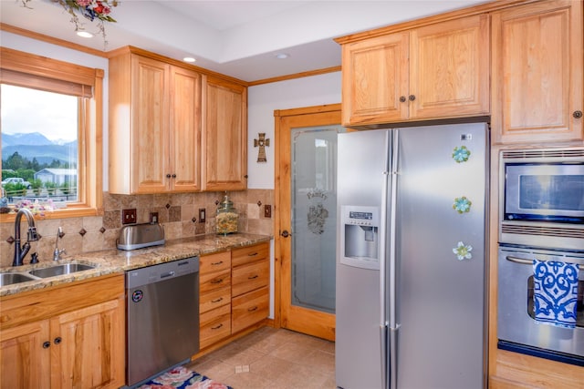 700 Airfield Rd, Libby, MT 59923 - kitchen with stainless steel appliances, a sink, tasteful backsplash, light stone counters, and a mountain view