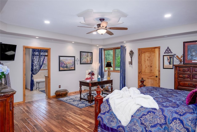 700 Airfield Rd, Libby, MT 59923 - bedroom with recessed lighting, wood finished floors, baseboards, ceiling fan, and ensuite bath