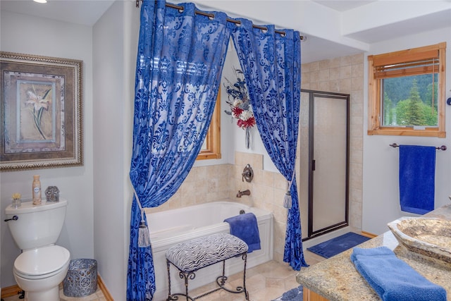700 Airfield Rd, Libby, MT 59923 - bathroom with vanity, a garden tub, a stall shower, and toilet