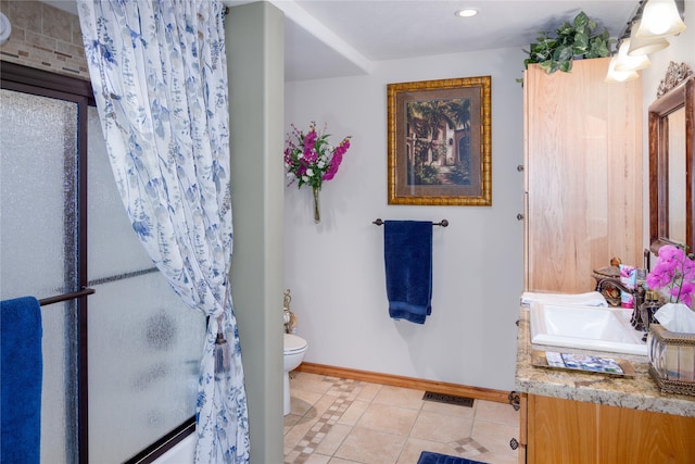 700 Airfield Rd, Libby, MT 59923 - full bath with tile patterned flooring, toilet, vanity, a shower with shower curtain, and baseboards