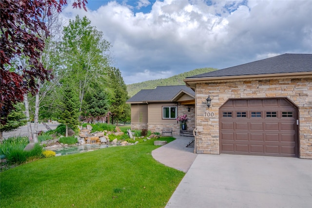 700 Airfield Rd, Libby, MT 59923 - view of front of house featuring stone siding, driveway, a front yard, a garage, and a shingled roof