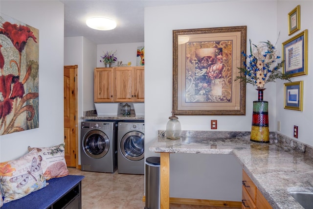 700 Airfield Rd, Libby, MT 59923 - laundry room featuring washer and clothes dryer and cabinet space