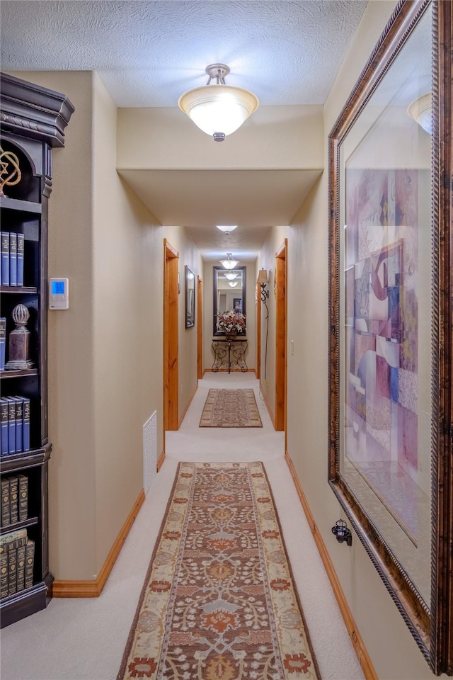 700 Airfield Rd, Libby, MT 59923 - hallway with a textured ceiling and baseboards