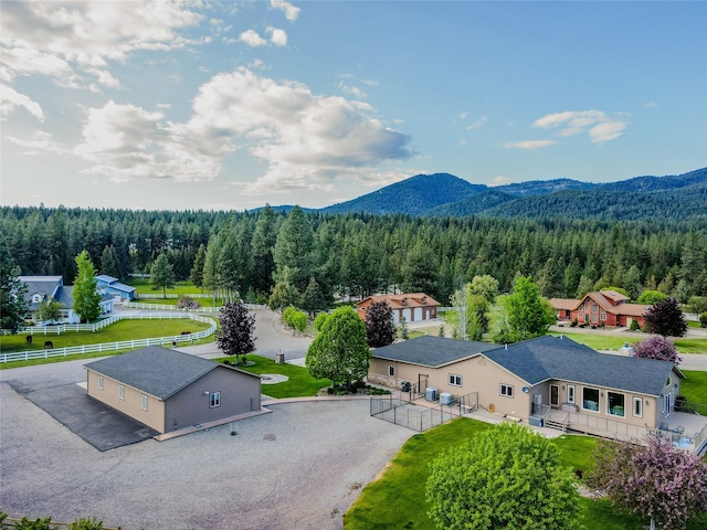700 Airfield Rd, Libby, MT 59923 - aerial view of property and surrounding area with a forest and a mountain backdrop