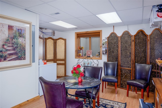 700 Airfield Rd, Libby, MT 59923 - dining area with a paneled ceiling, wood finished floors, and washer / dryer