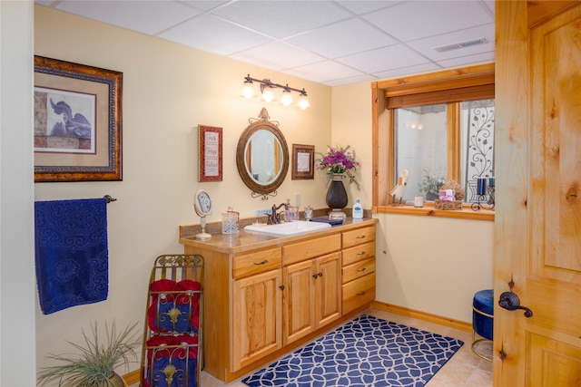 700 Airfield Rd, Libby, MT 59923 - bathroom with vanity, a drop ceiling, and baseboards