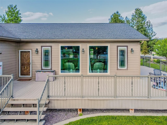 700 Airfield Rd, Libby, MT 59923 - back of house with a deck and roof with shingles