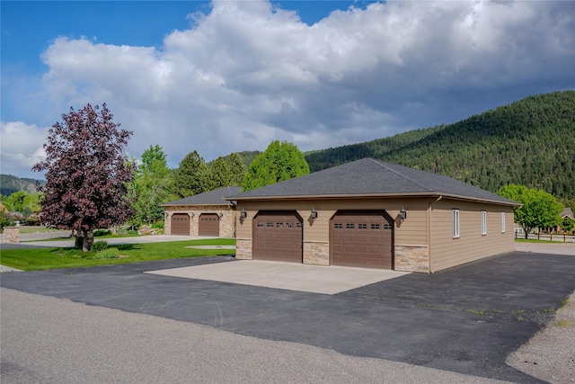700 Airfield Rd, Libby, MT 59923 - detached garage featuring a mountain view and a view of trees