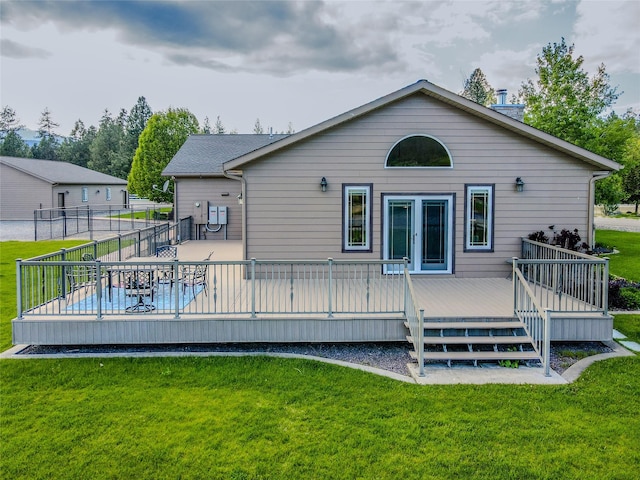 700 Airfield Rd, Libby, MT 59923 - back of house featuring a lawn and a deck