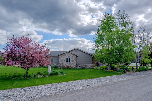 700 Airfield Rd, Libby, MT 59923 - view of front of house featuring stone siding and a front lawn