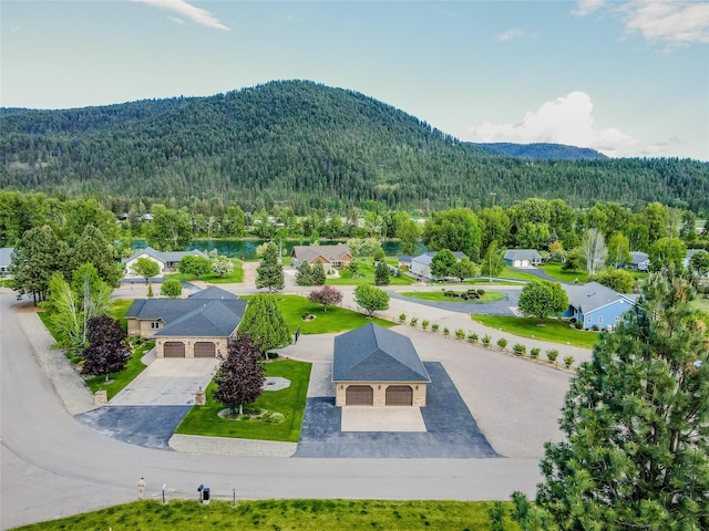 700 Airfield Rd, Libby, MT 59923 - aerial view of a heavily wooded area and mountains
