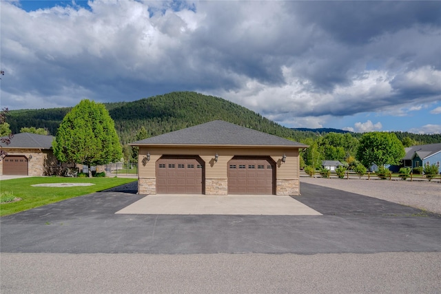 700 Airfield Rd, Libby, MT 59923 - detached garage featuring a mountain view