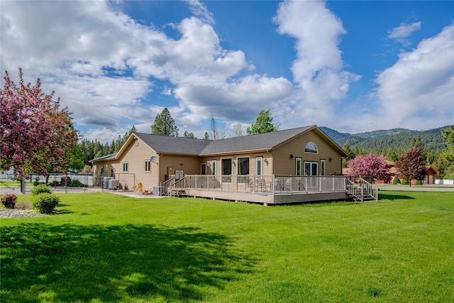 700 Airfield Rd, Libby, MT 59923 - back of property with a deck with mountain view and central AC unit