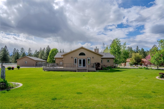 700 Airfield Rd, Libby, MT 59923 - rear view of house with a deck and a chimney