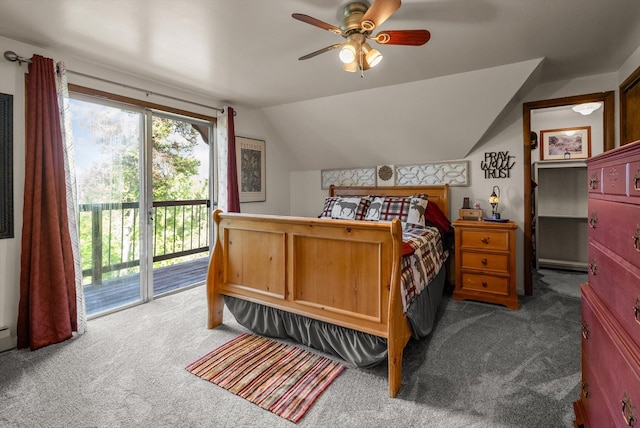 33893 Redgate Dr, Bigfork, MT 59911 - carpeted bedroom featuring access to exterior, vaulted ceiling, and a ceiling fan