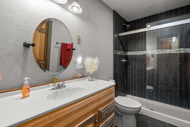 33893 Redgate Dr, Bigfork, MT 59911 - bathroom with a shower stall, vanity, and a textured wall